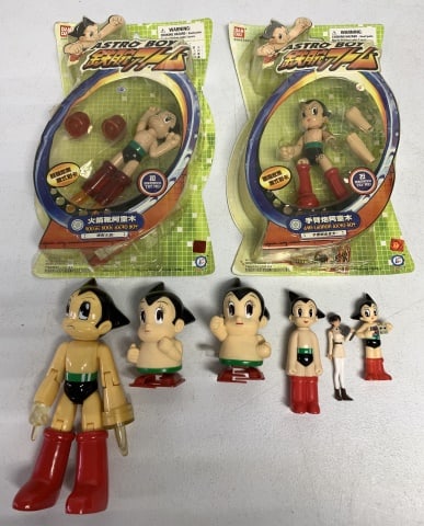 lot of 8 Astro Boy Figures Rocket boot, Arm Cannon: some in original blister packs, some used, some wind up