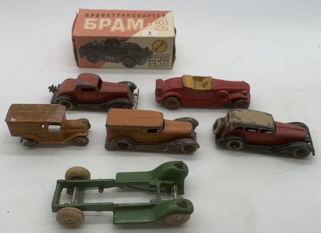 7 Vintage metal toys; Tootsietoy, Russian, others: Russian tank in box; all others show heavy wear and/or damage