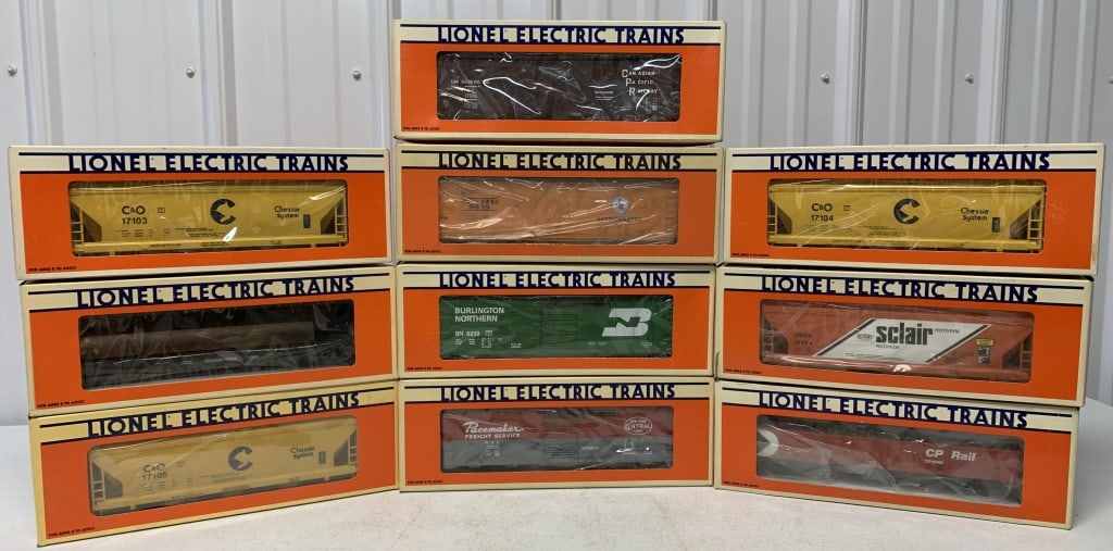 10 Lionel boxcars, gondola, hopper, Reefer: O gauge, CP flatcar, C&O bay hopper, Chessie System Hopper, New York Central reefer, CP reefer, Sclair hopper, CP gondola, New York Central boxcar, Burlington boxcar, Chessie hopper, looks unused, som