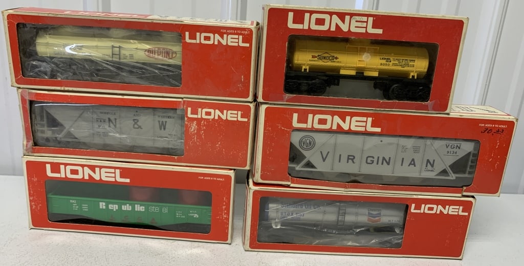 6 Lionel O guage cars in boxes: Dupont, Chevron and Sunoco tankers; Norfolk & Western and Virginian Hoppers and Republic Steel Gondola; boxes have wear and damage