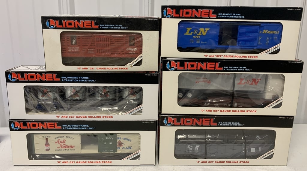 6 Lionel cars in boxes: O and O27 gauge; Lionville Circus Animal car; Budweiser VAT car; Anheuser Busch Reefer; Louisville & Nashville Box car, flatcar w/trailer and Gondola with Coil Covers; boxes have wear and minor damage