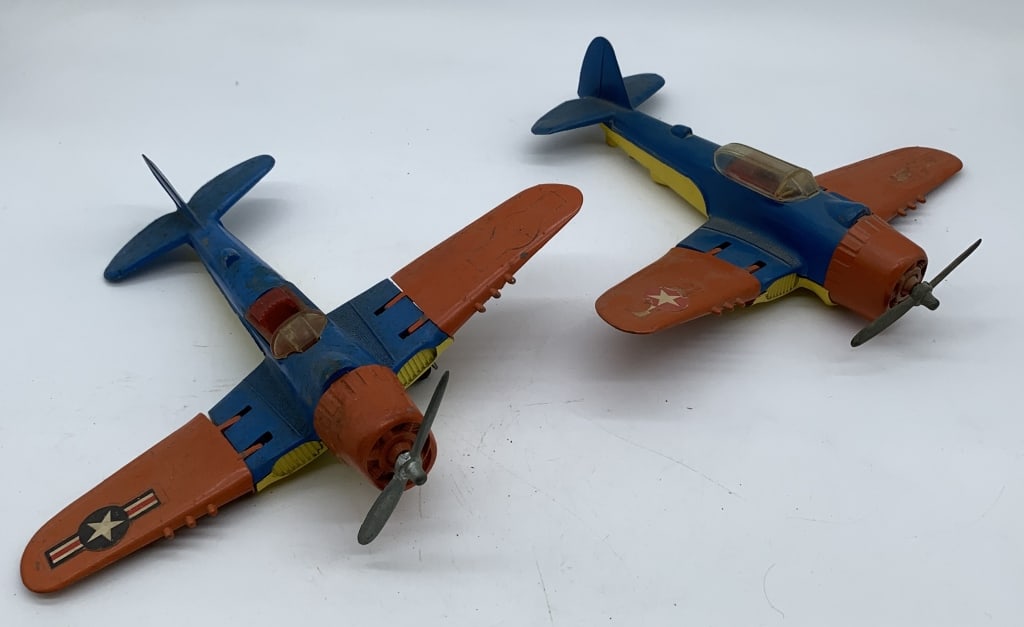 lot of 2 Hubley Kiddie Toy Fighter Plane Toys: one of the cockpits is missing part of the plastic window, both have some paint chips, some worn and missing decals