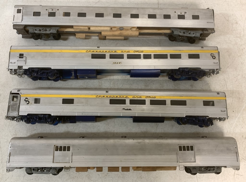 lot of 4 Metal Train Cars: probably O gauge, manufacturer unknown, not marked, use and wear, may or may not be complete, decals worn, spray painted blue on the bottom