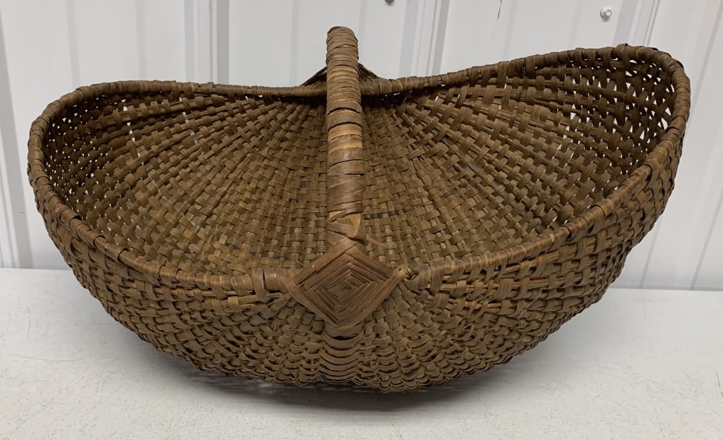 Woven Basket with Handle: weaving torn on bottom,on side