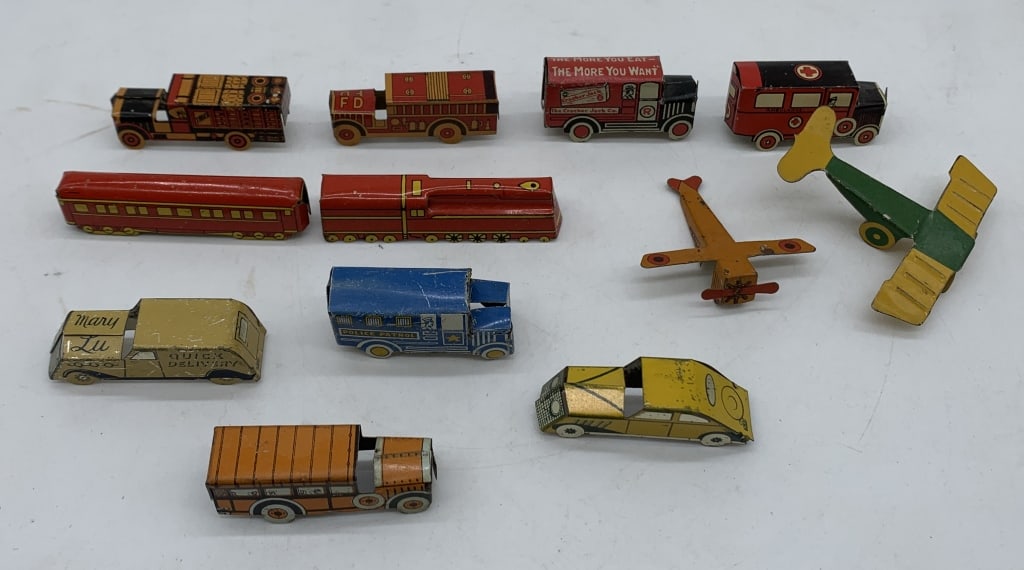 12 transportation Cracker Jack tin litho prizes: cars, trucks, trains and planes; some scratches as shown