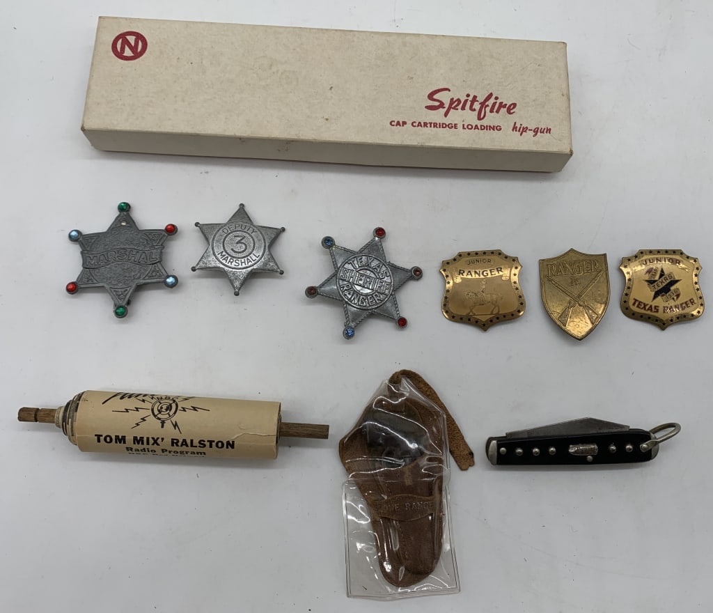 lot of 10 Vintage Western related items: 6 children's western badges all showing wear; Tom Mix cereal premium; Lone Ranger small gun w/holster(damage and wear to leather); Camco Lone Ranger pocket knife with wear and damage to blade; Nichols