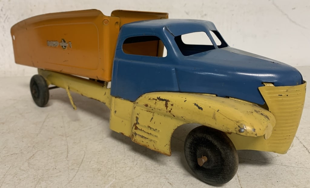 Buddy L Pressed Steel Dump Truck: dumping mechanism works, lots of worn paint, chipped paint, decals are incomplete, some rust, wooden wheels