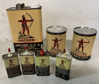 7 empty Archer products cans