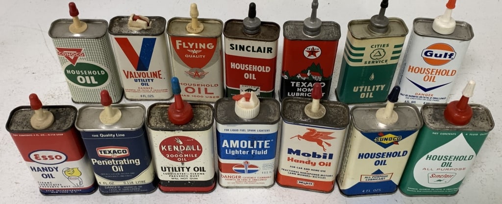 14 small oiler cans; all but three contain product (1 of 9)