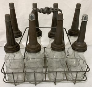 8 glass oil bottles w/ spouts in wire carrier