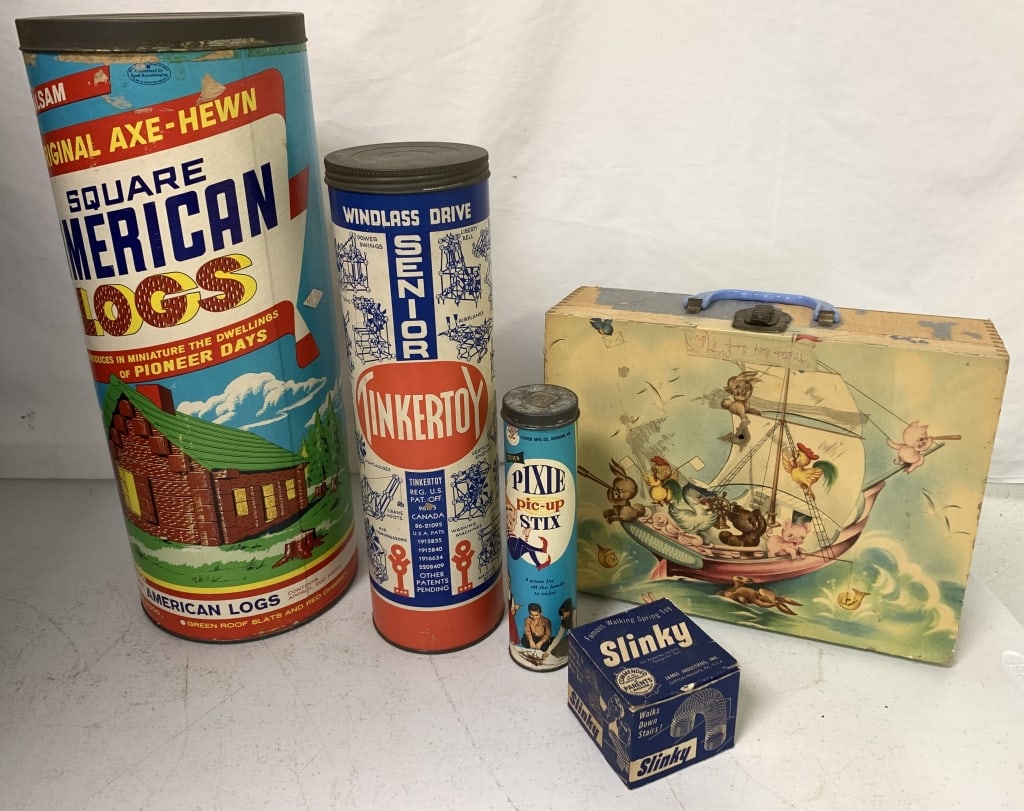 American logs, TinkerToys, Slinky, Pixie sticks, e: canisters and boxes have wear; toy suitcase has paper loss