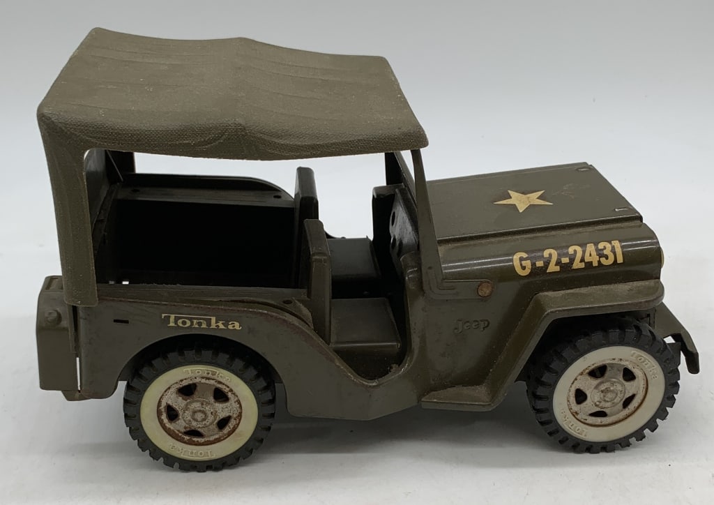 Tonka Military Jeep: has scratches and rust, frame is bent and name is written in marker on bottom