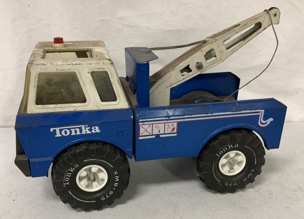 Tonka Wrecker: has scratches, paint and sticker loss, rust and discoloration