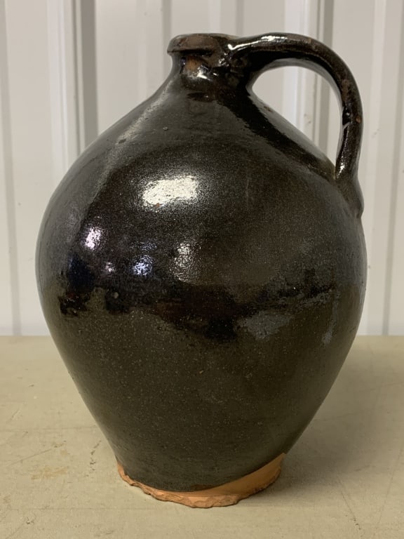 ovoid redware pottery jug: has some chips especially around base