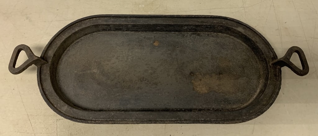 cast iron griddle: has rust and some pitting