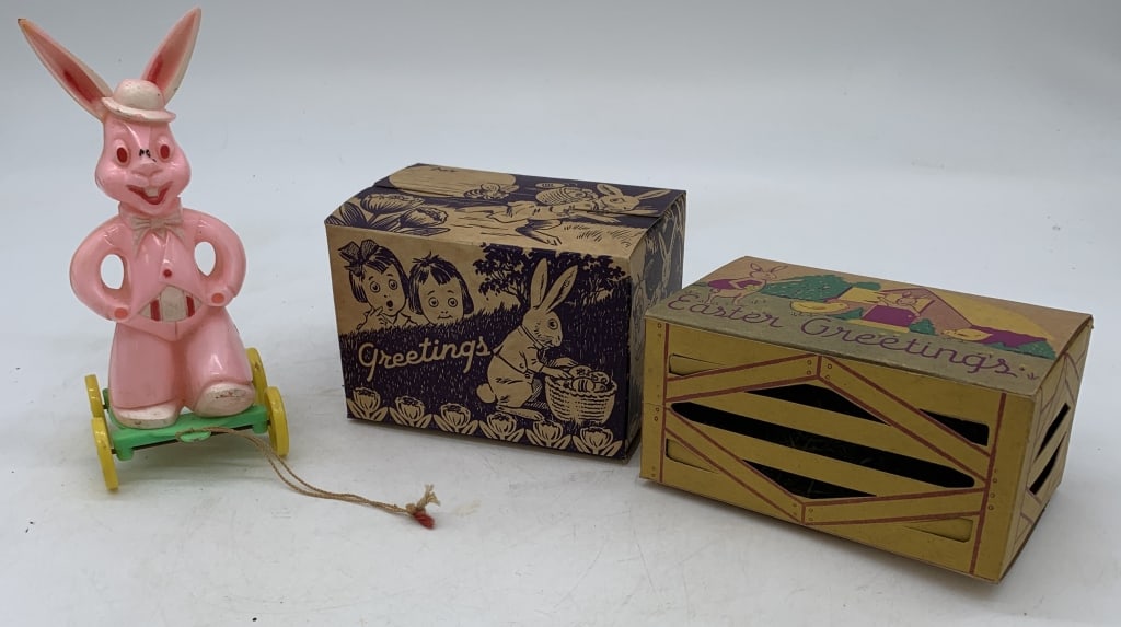 plastic Easter rabbit on wheels + two candy boxes: some scratches and marks to plastic and there is some staining and paper missing from cardboard boxes as shown