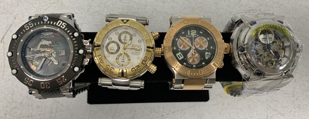 4 Invicta men's watches: do not appear to have wear; 1 still has tag and protective wrap