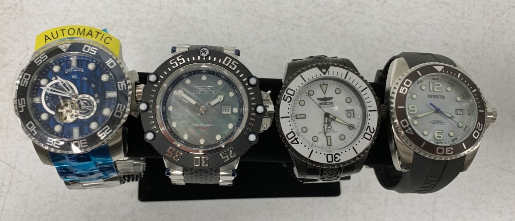 4 Invicta men's watches: some have wear; one has tag and protective wrap; Watch purchases that require shipping must be paid by Wire or Check, no Credit Cards