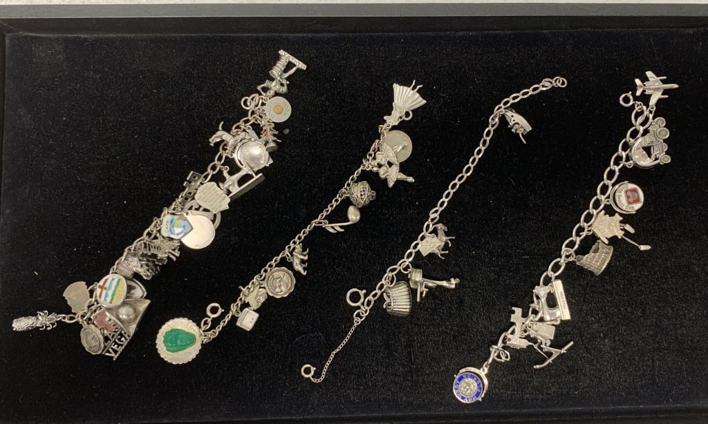4 sterling silver charm bracelets: see photos for charm depictions; Jewelry purchases that require shipping must be paid by Wire or Check, no Credit Cards