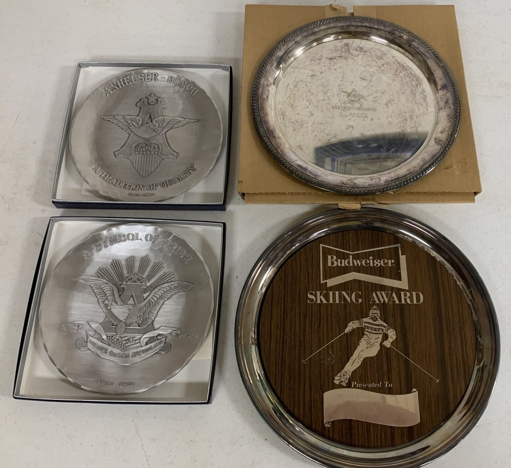 4 Anheuser-Busch plates: 2 United Way Awards; ski award, centerpiece has become unglued and has scratches; 1971 Sales Convention Silver-plate has scratches