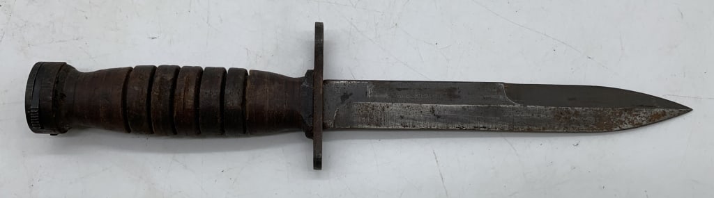 Military Bayonet: no names, some type of marking on the bottom of the handle, wooden grip, wear and age