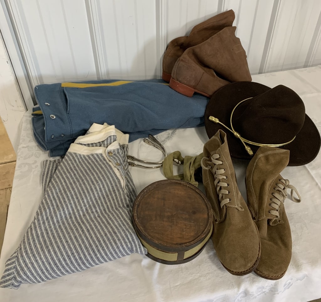 lot of reenactor apparel; boots, hat, pants, spurs: canteen and undershirt; all shows wear