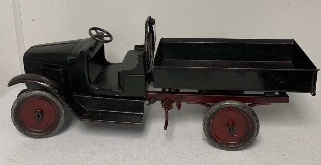 Buddy L Dump Truck: has some repaint; has scratches,paint loss and rust