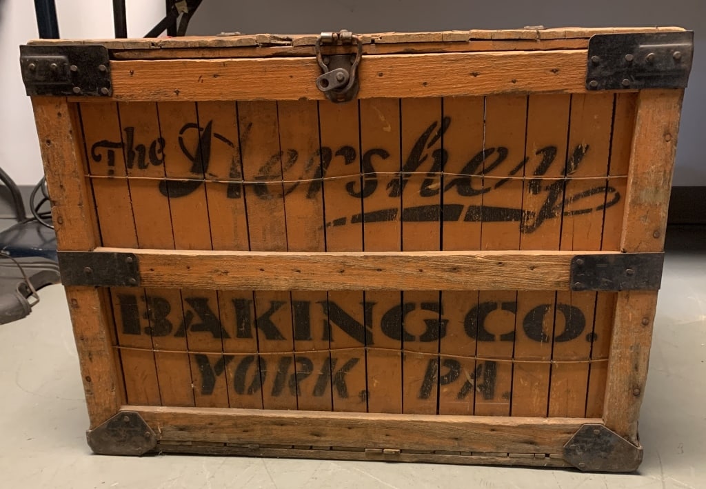 The Hershey Baking Co. York,PA crate: 27 3/8" wide x 26" deep x 20 1/8" tall; has wear with nicks,paint loss,cracks and some broken and missing pieces of wood as shown; some paint loss and rust to metal pieces
