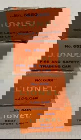 4 Lionel train cars in boxes