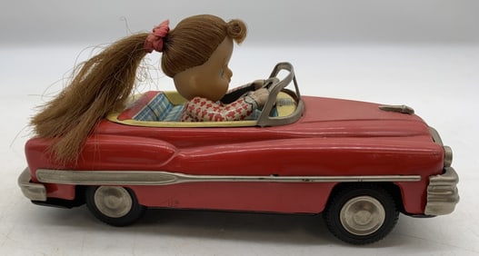 Japanese tin friction girl in convertible