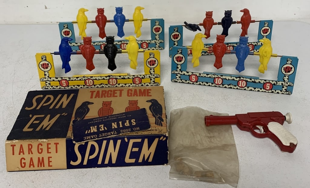 4 Wyandotte Spin 'Em" targets, 1 gun, five corks: and partial box; all have wear, one target bird broken, box is damaged