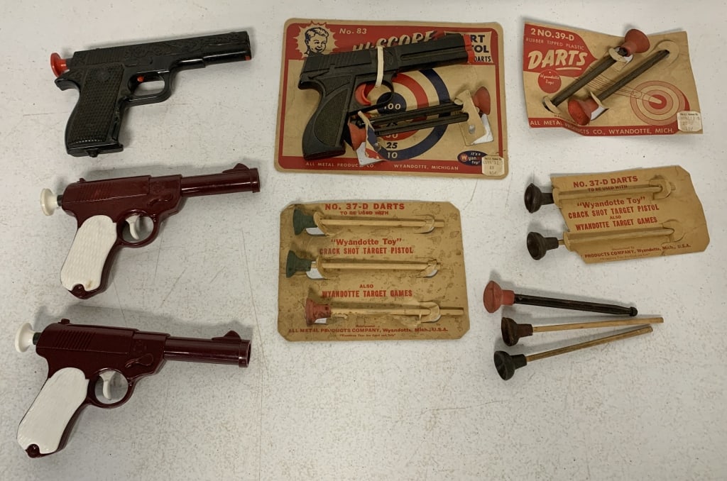 Wyandotte Dart Guns and dart packs: Show wear and packaging has some damage; darts have hardened