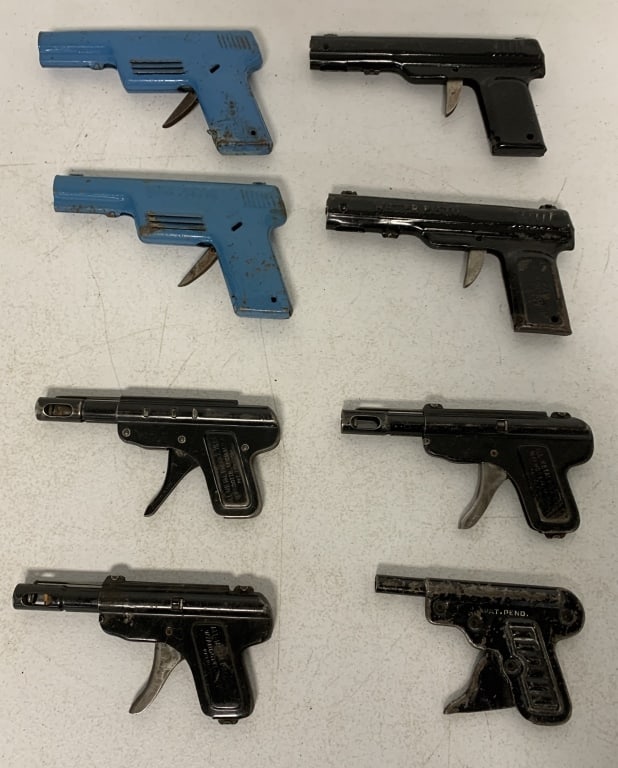 8 metal guns most Wyandotte bell and cork: have scratches, paint loss, rust and some damage