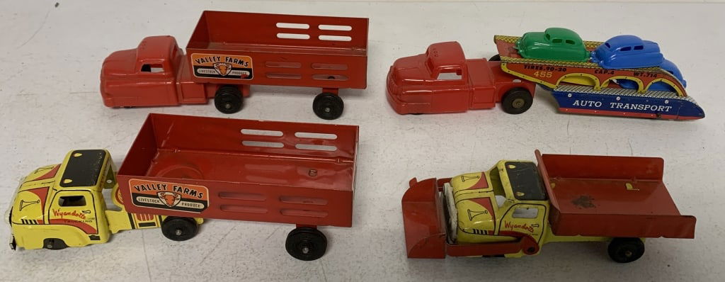 4 Wyandotte metal and plastic trucks: show wear with scratches and paint loss; all cabs may not be paired with proper trailers