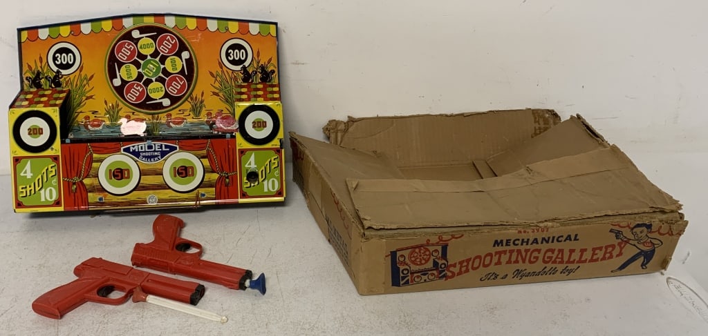 Wyandotte Mechanical Shooting Gallery: box has damage; gallery is scratched, dinged, missing belt and darts are hardened and missing