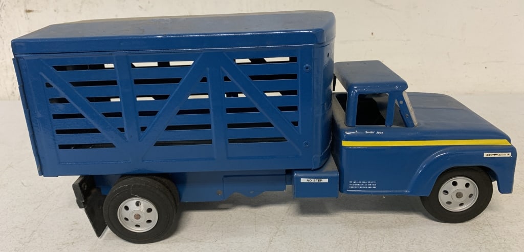 pressed steel custom made truck: has wear with scratches; repainted and decals applied; see parts from Marx and Ertl