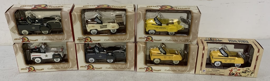 7 1:10 Scale die cast pedal cars in packaging: packaging has wear