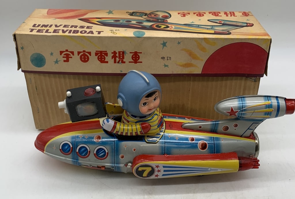 ME777 Universe Televiboat battery op. in box: has wear with scratches; box has wear with some fire damage; made in China