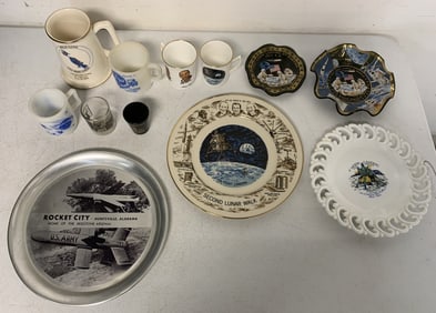 lot of space theme plates, glasses, mugs, etc.