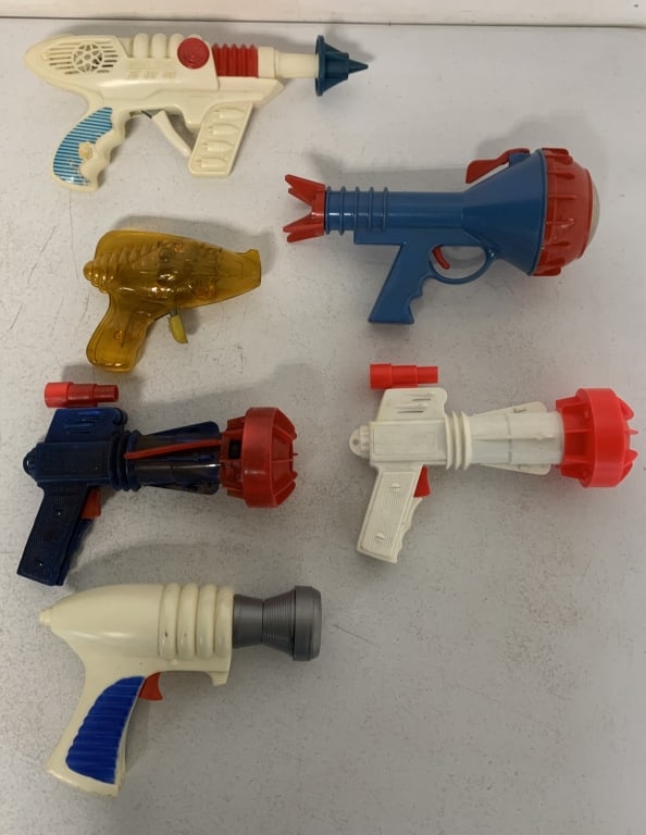 6 space guns: have wear with scratches, paint loss, peeling stickers, etc.