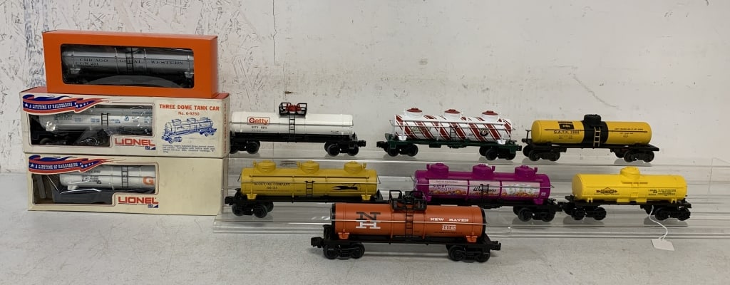 10 Lionel Oil Tank Cars: all with boxes but many are reproductions some with damaged cellophane, O gauge