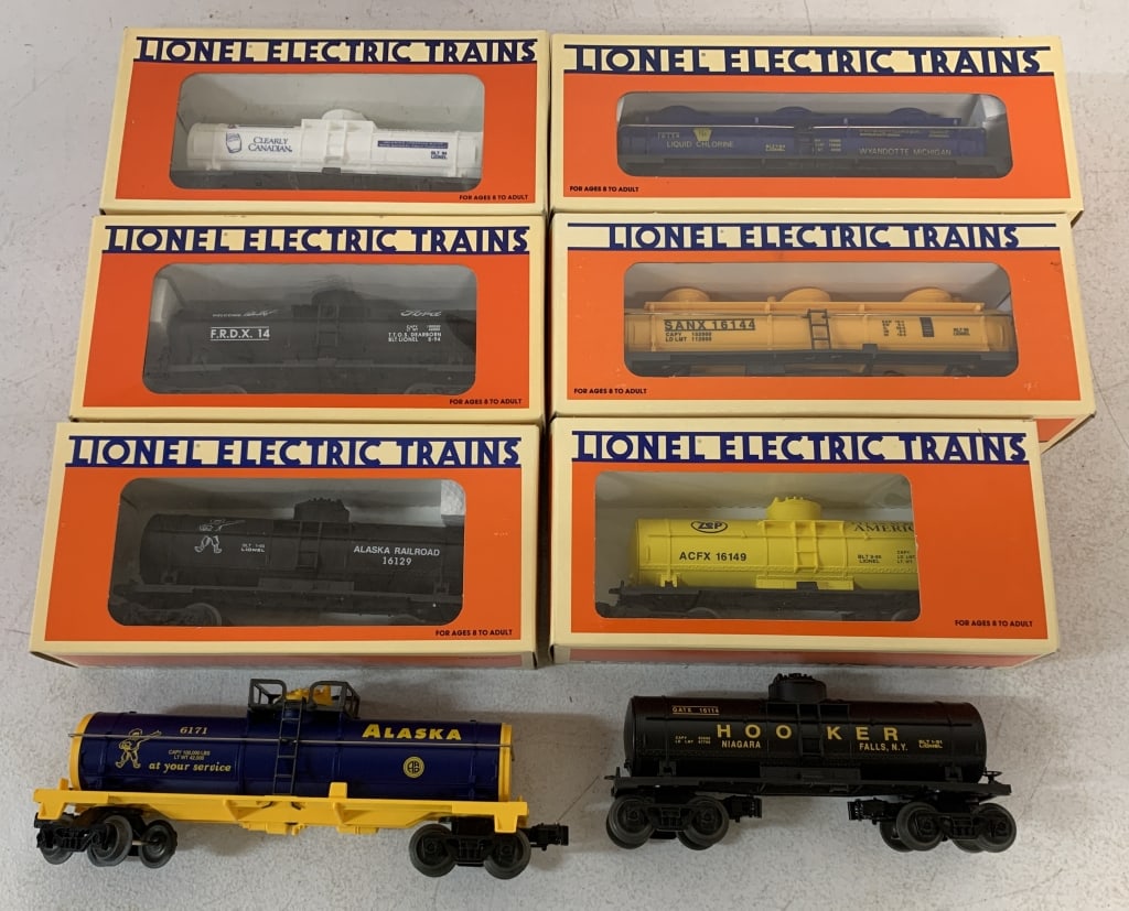 8 Lionel Oil Tank Cars w/ Boxes: some boxes are reproductions, some cellophane damage, O gauge