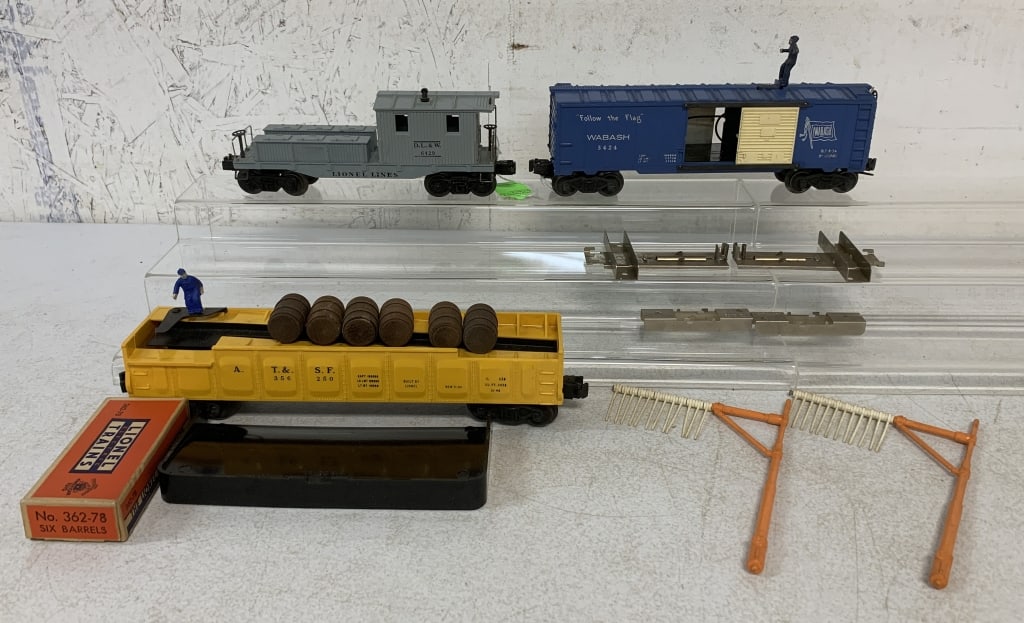 4 Lionel Wrecking/Barrel/Brakeman Cars/Boxes: 3424,3562, 6419, low bridge signal set, toys have some wear, boxes have wear, age, and damage, O scale