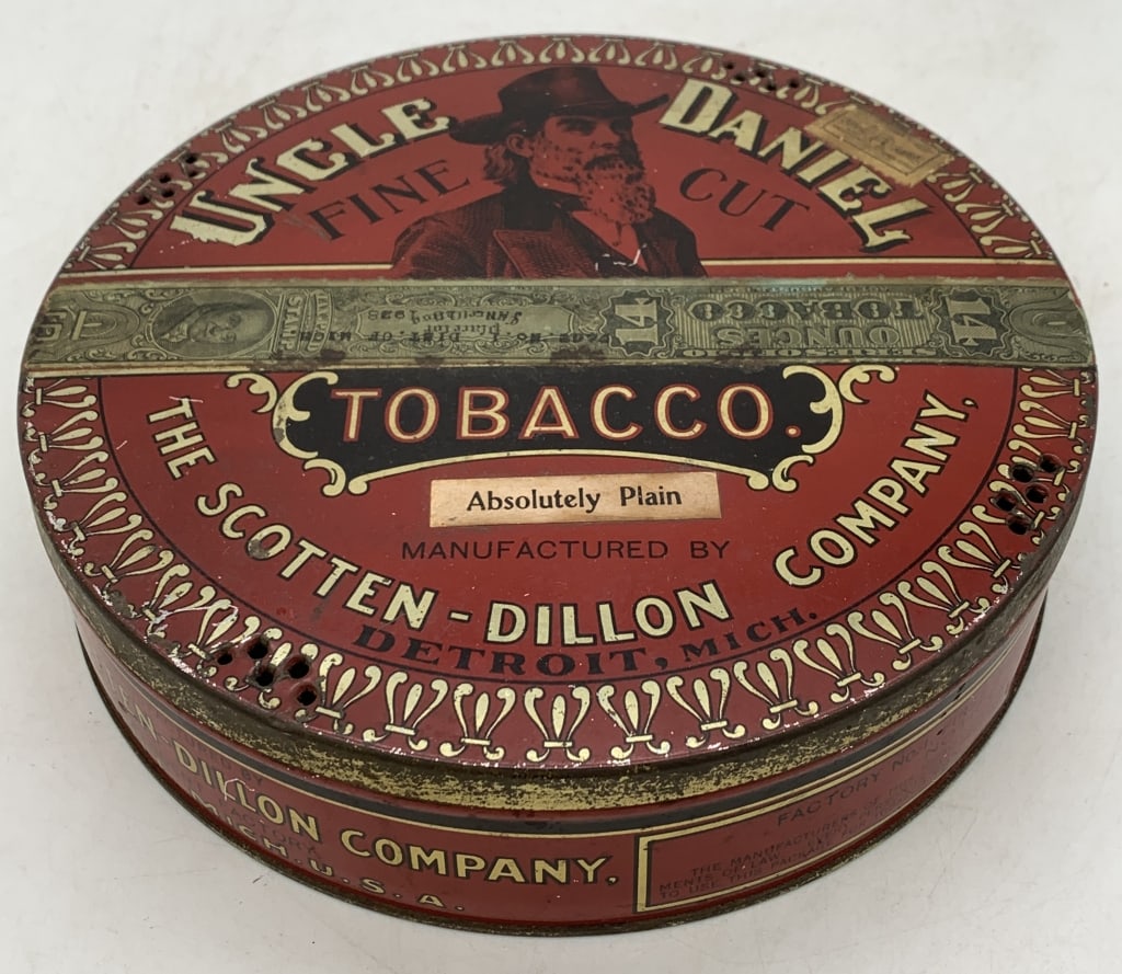 Scotten-Dillon Uncle Daniel Fine Cut Tobacco Tin: small dents along the sides, litho has wear and some peeling, has taxation label across the front of the lid
