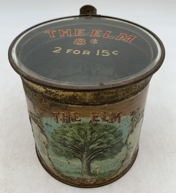 The Elm Cigar Tin w/ Glass Top Cover: lots of wear, pitting, labels are raised from the can and have wear and discoloring, some small dents on the sides, rust inside and out
