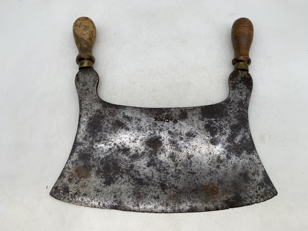 j. Carde Two Handle Butcher Knife: rust and pitting throughout the blade, worn wooden handles