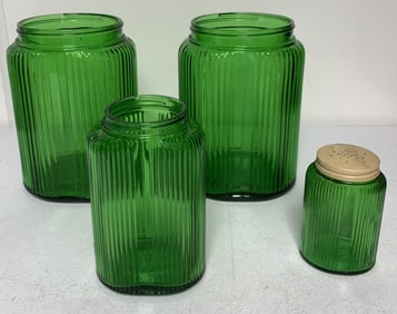 4 green glass jars, only one has lid