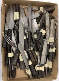lot of wood handled knives and forks
