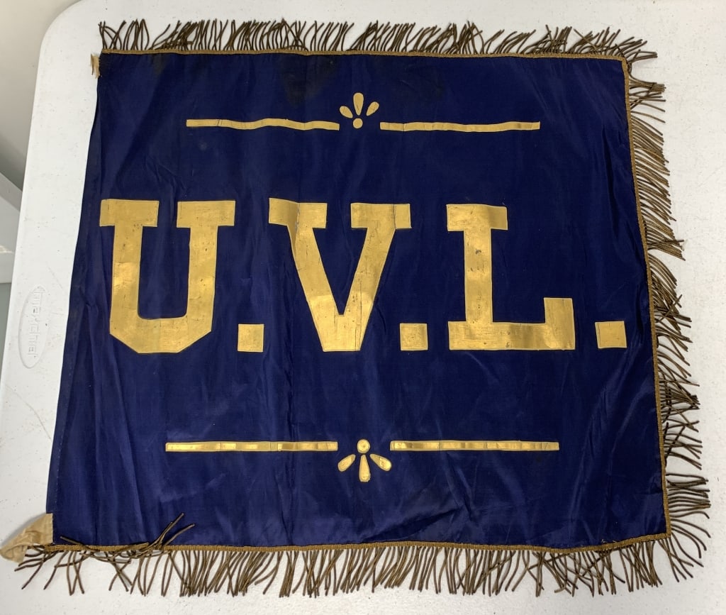 early U.V.L. flag: has wear with staining and some damage and loss of paint