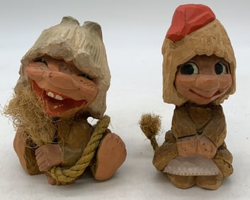 2 carved trolls marked Henning
